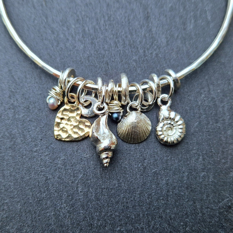 Bespoke silver rock pool bangle with 9ct yellow gold heart charm, 2025