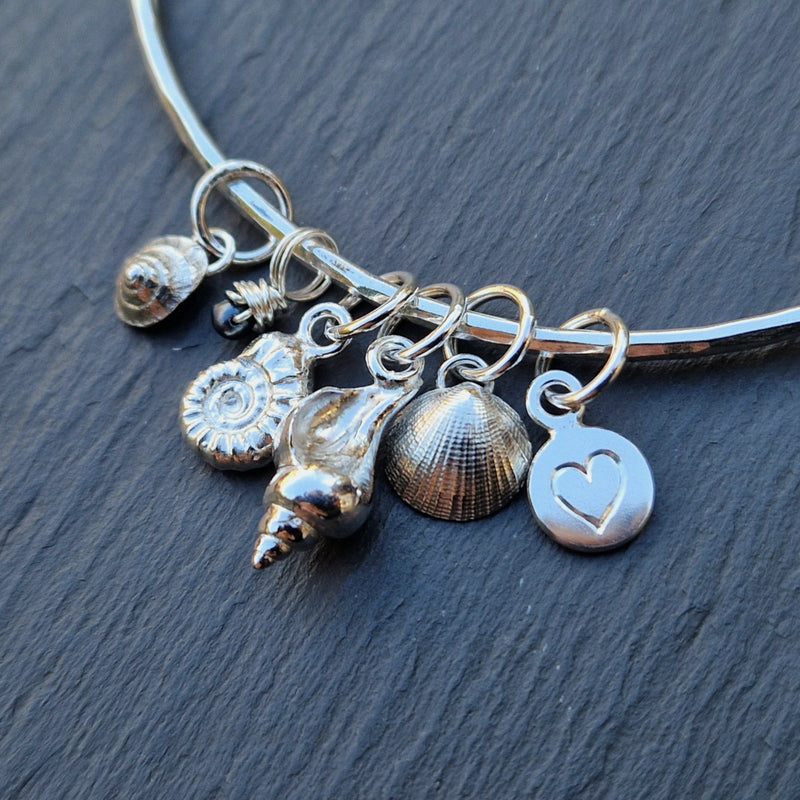 custom silver rock pool bangle with engraved heart charm, 2025
