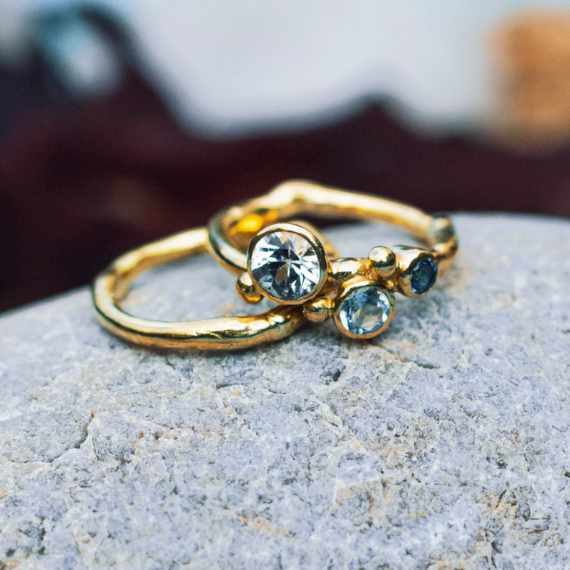 18ct Yellow gold ring with 3 stones: white sapphire, sky blue topaz and London blue topaz, 2019