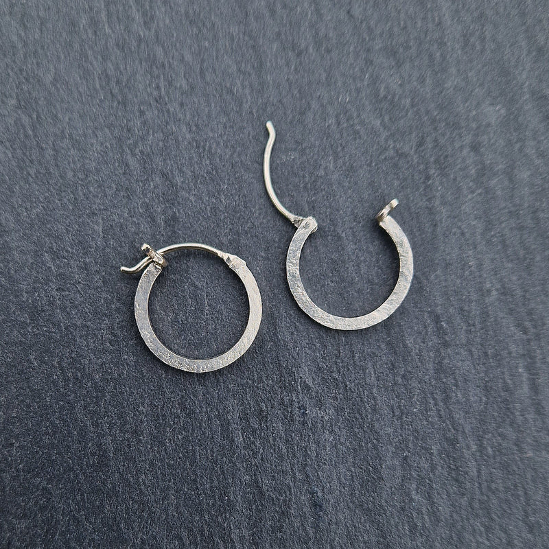Tiny silver hinged hoops, 2023