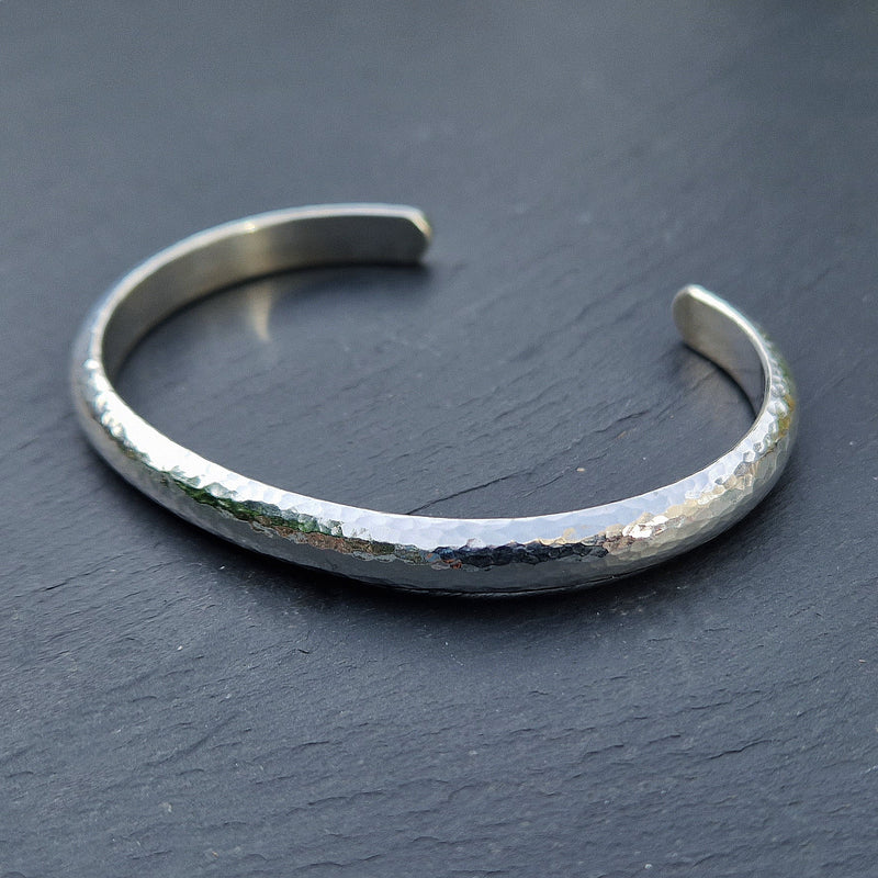 Weighty silver D-shaped beaten torque bangle, 2023